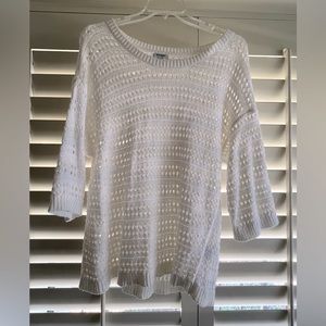 Women’s white knit sweater.
